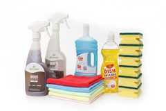Cleaning products including bottles, sponges, and cloths on a white background